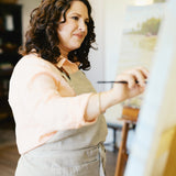 Rebecca Deneau painting in her Northern Michigan studio